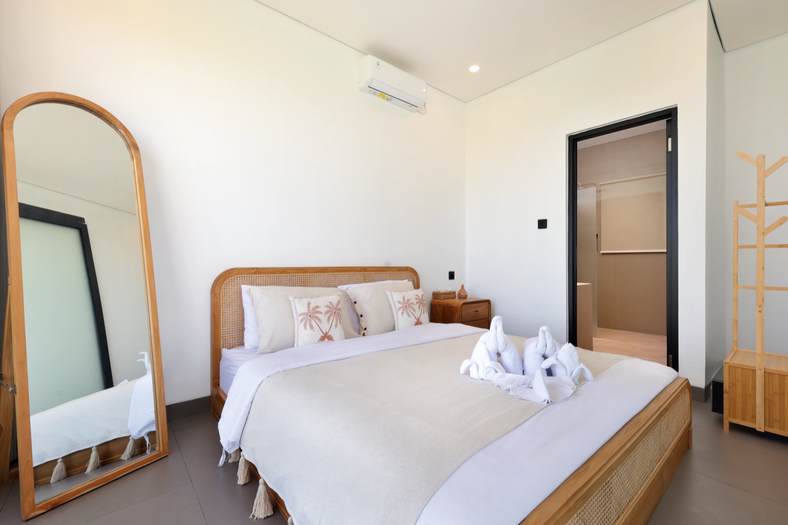 Bedroom 2 with queen bed and garden view
