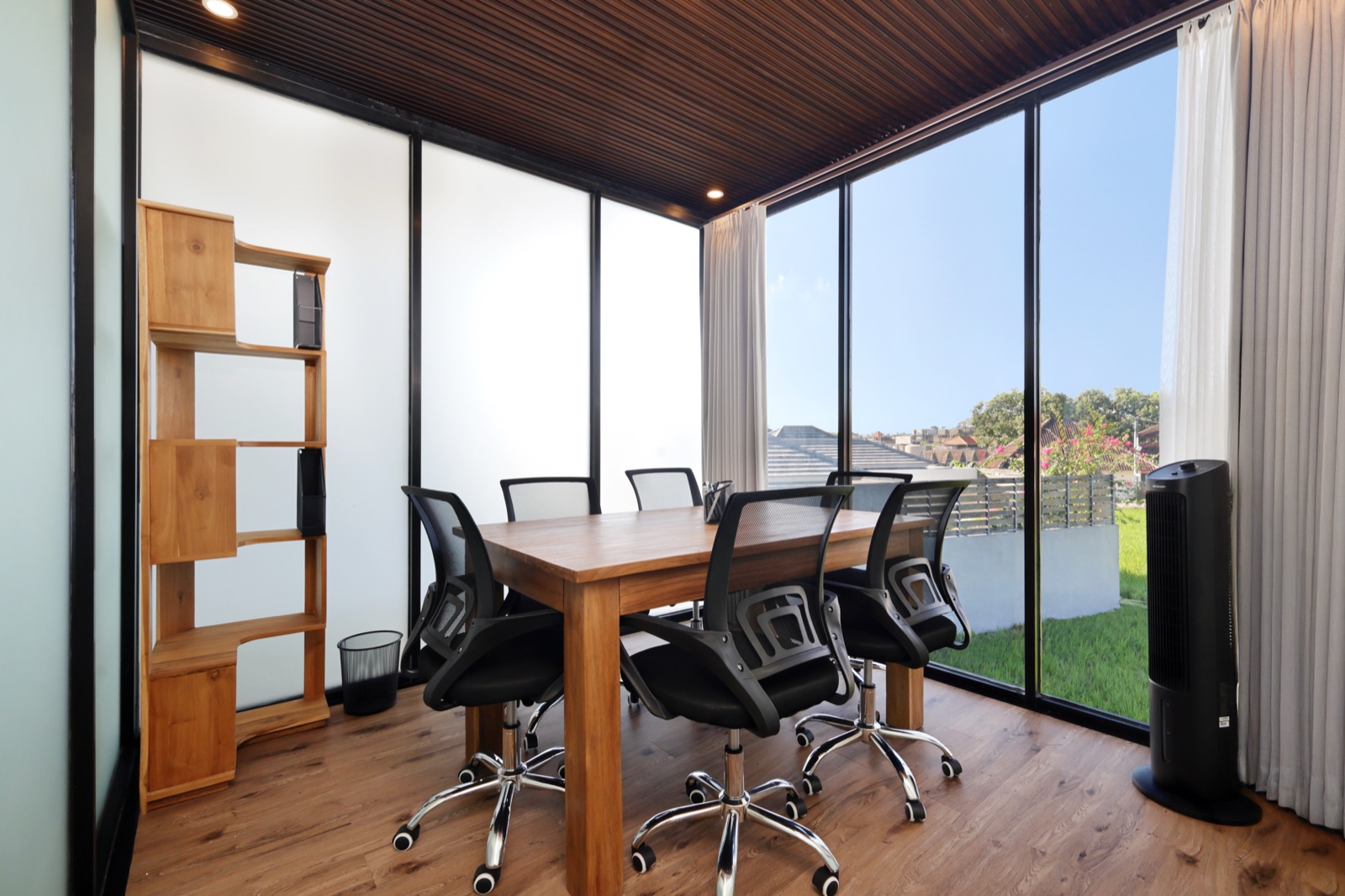 Business centre with meeting table and rice field view