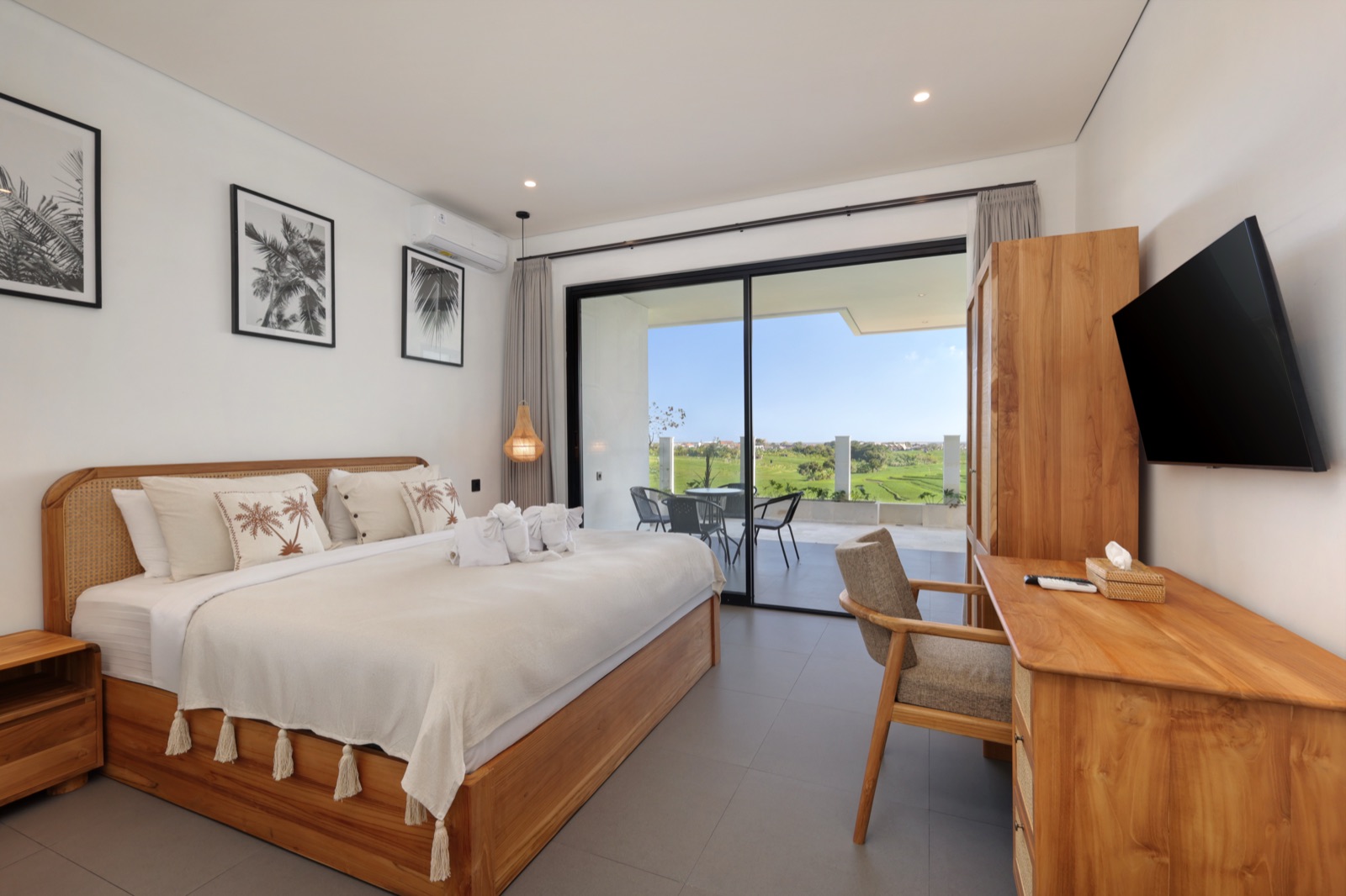 Master bedroom with king bed and rice field view